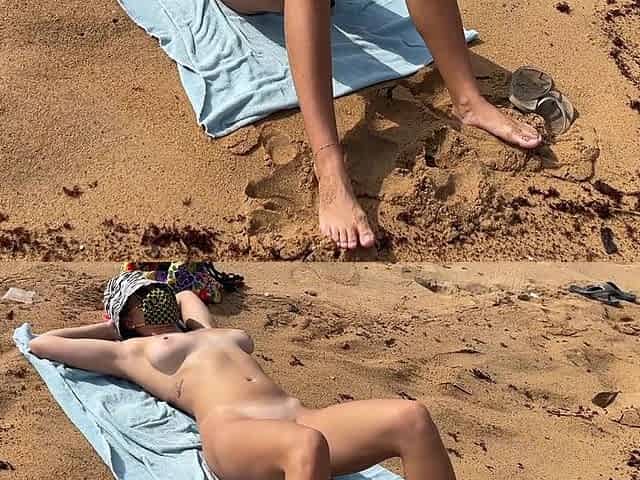 A Busty Blonde Is Walking and Sunbathing Naked