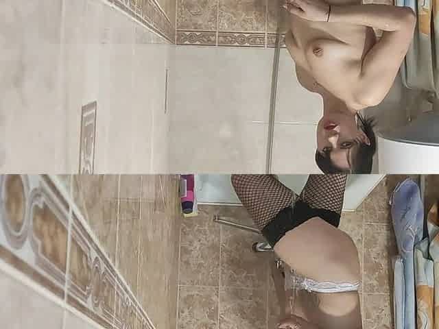 DATEZONE - Nice-looking amateur in fishnet nylons masturbates standing in the washroom