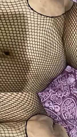 Wildenglishbbw laying in bed in fishnet body suite