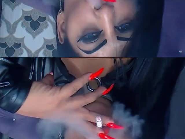 Smoking with red lips and long nails