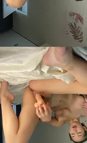 Hot slender chick pleases her pussy with her dildo and massages it with her hands