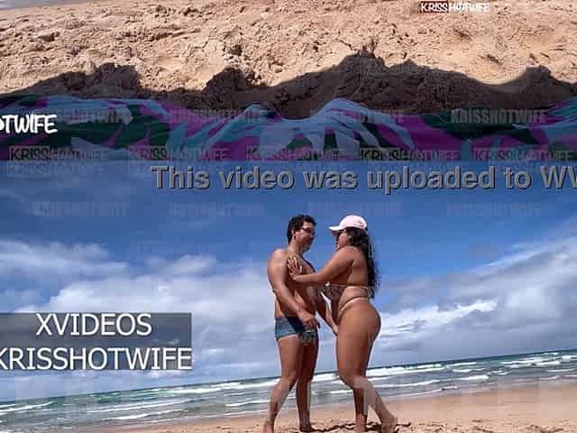 Kriss Hotwife In Micro Bikini Showing Off On Public Beach With Her Tame Horn On The Side