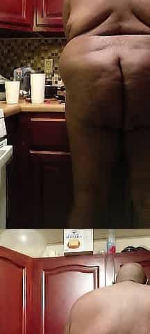 Nudist doing dishes