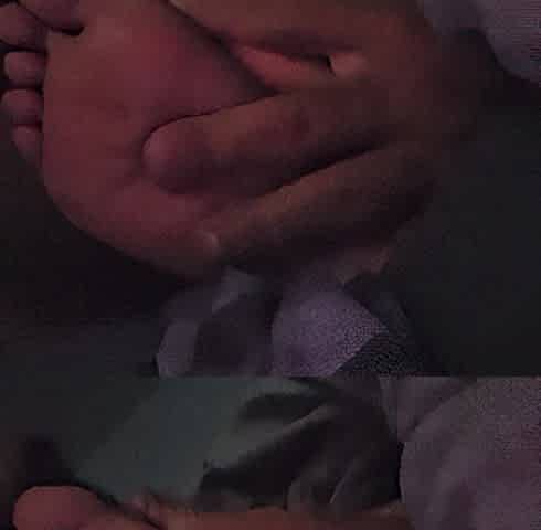 Sucking her toes whilst this babe watches a clip
