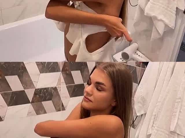 Blonde babe masturbates with a dildo after the beach.
