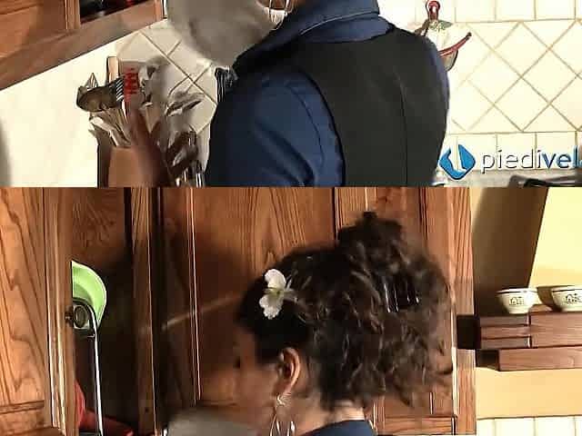 Flavia, cute brunette hair plays with her feet in the kitchen