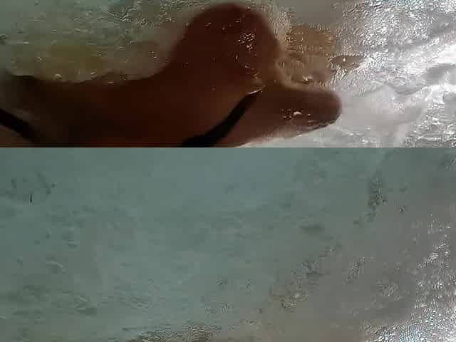 Large breasts floating in the whirlpool