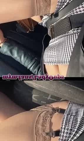 Lady Oups short suit nylons and suspender strap in car