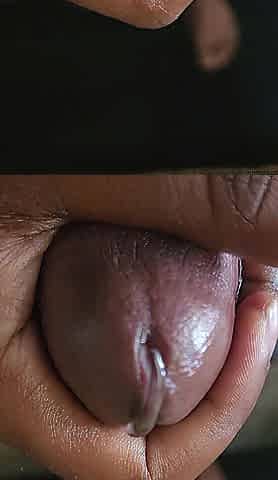 Ebony ramrod being stroked gently