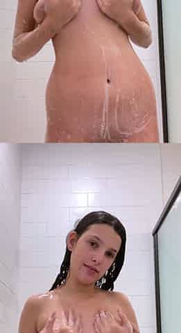 Busty curly brunette with big boobs fucks on couch