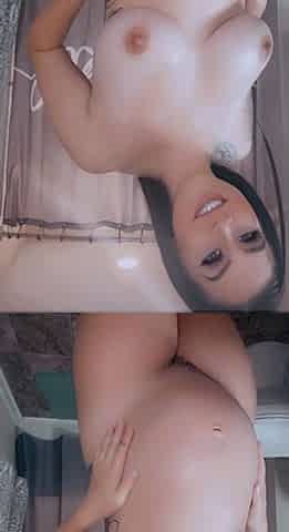 Busty babe playing with her big boobs