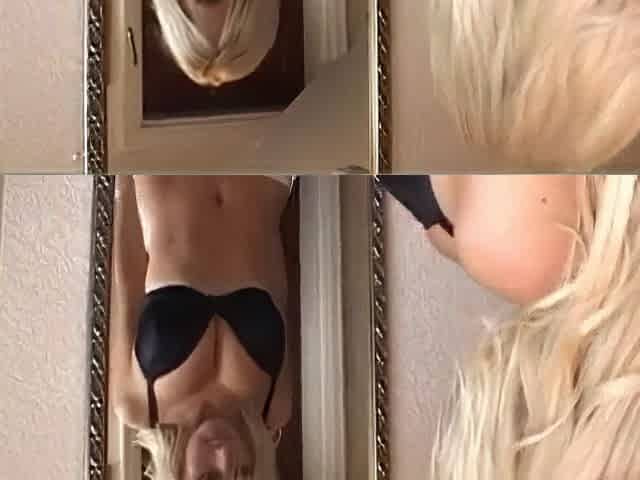 Breasty golden-haired model Michelle Marsh gets topless for a photoshoot