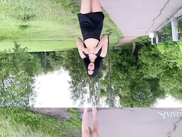 Beautiful Girl In A Dress Walks In The Park