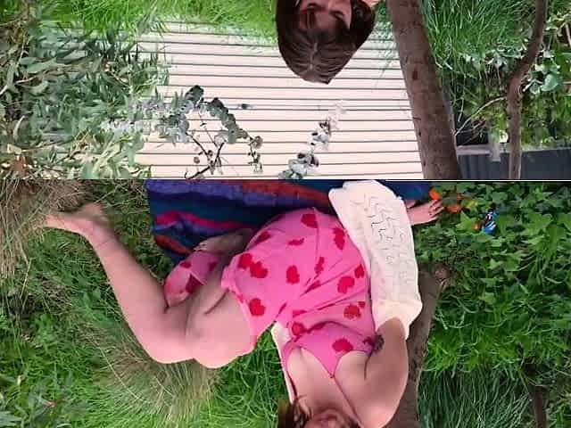 Busty hottie fingers her hairy pussy in the garden