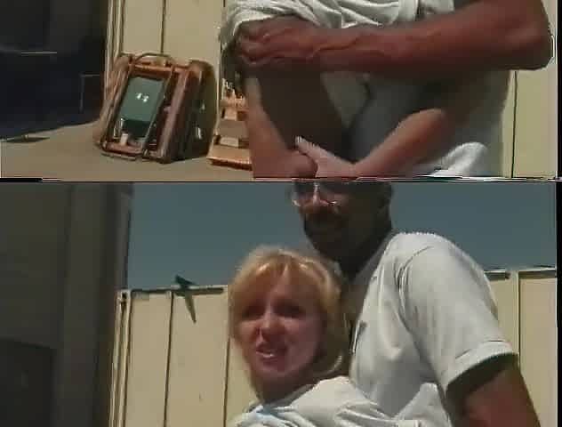Golden-haired bitch sucks and bangs massive ebony weenie on a rooftop