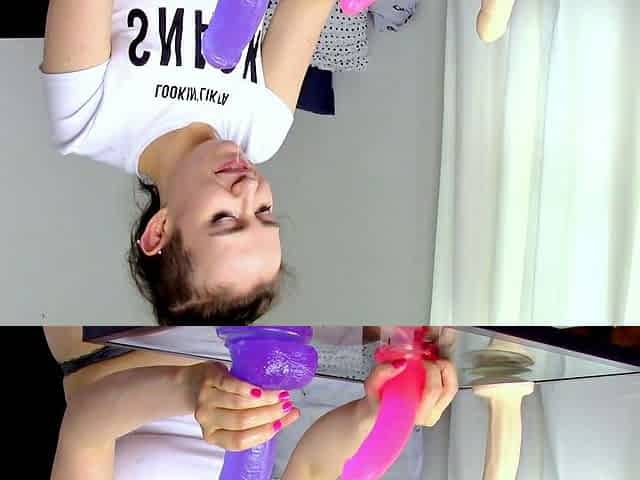 Pink labia close up of naive brunette playing with her name