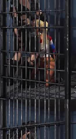 Batman bangs a horny cuffed Harley Quinn in prison