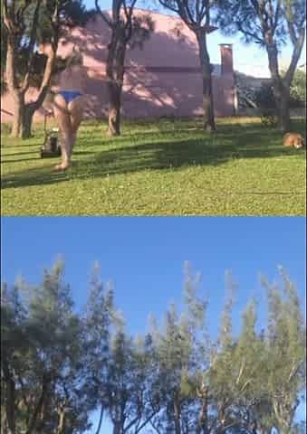 Stepmother in a Bikini in the Garden of the House Makes a Video for Her Stepson, to Show off Her New Clothes.