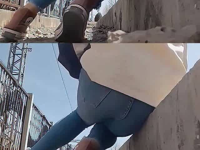 The very despairing woman was pissing in her jeans beside the railroad tracks