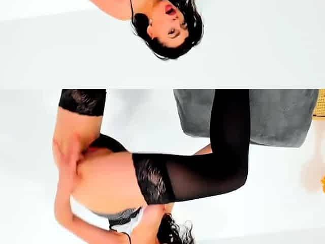 This stockinged pin up babe goes solo toying herself