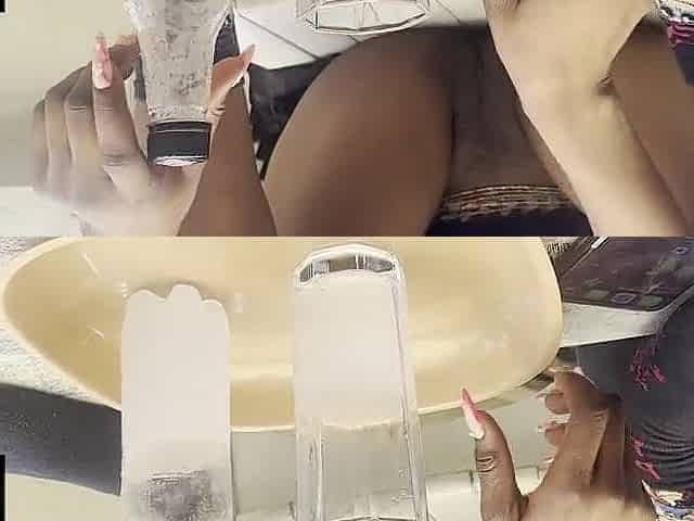 Black beauty displays her bald vagina during the time that enjoying drinking
