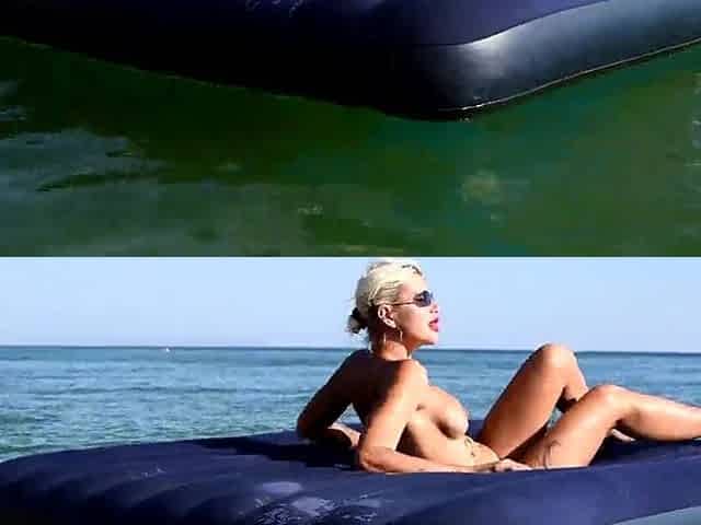I spy on the beach as a angel with large tits sunbathes in front of the public and dolphins