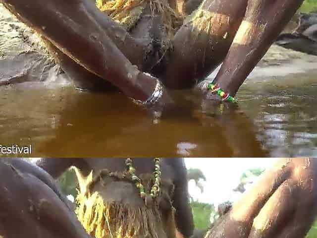 Hawt slender Afro village woman bathing and teasing in a river