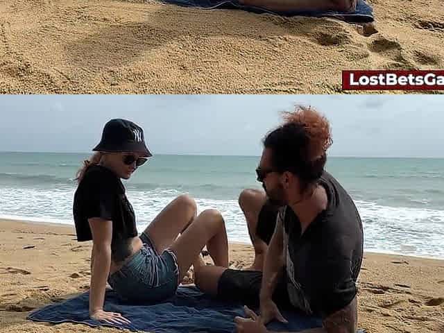 A slutty pair playing undress tic tac toe on the beach