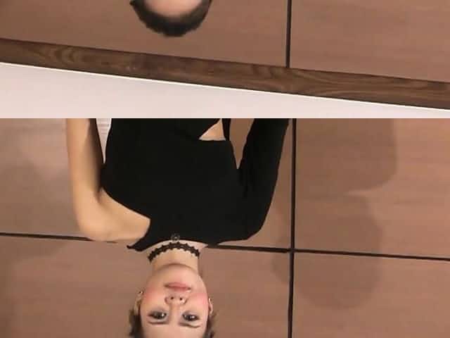 Asian beauty takes her dress off in a very seductive routine