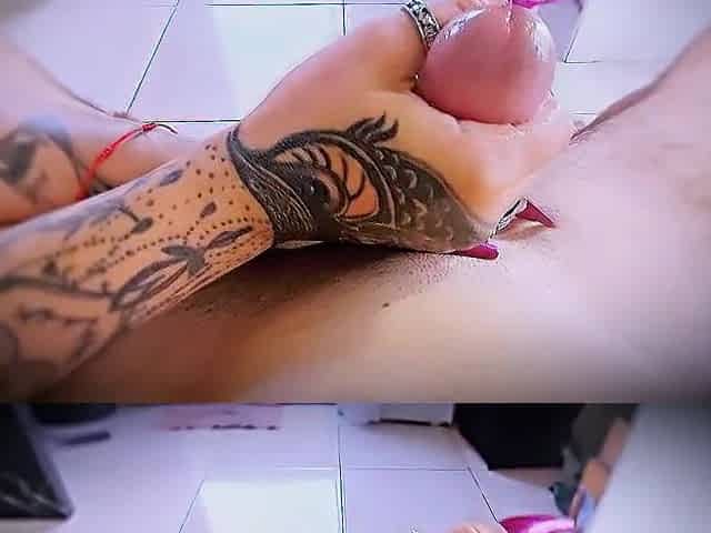 Close-up masturbation with tattooed hands and ring friction.