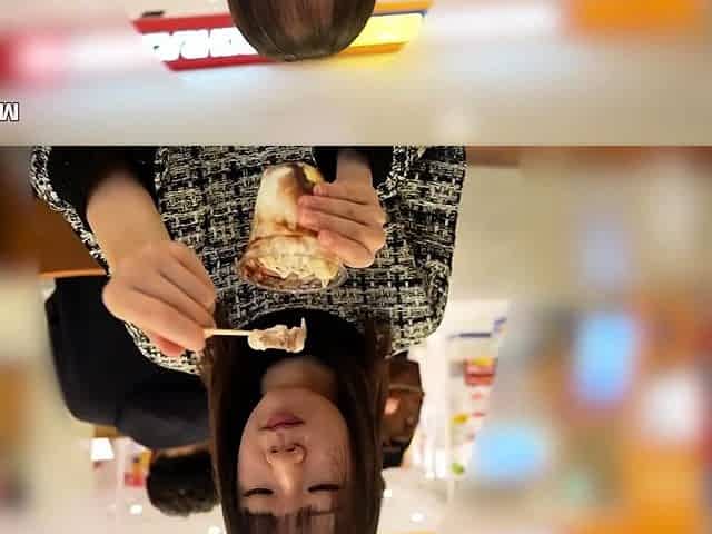Asian bimbo sucks on a big cock close up