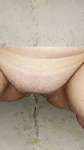 Beauty voids urine in tub