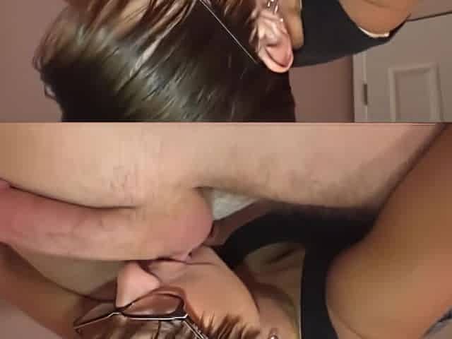 Short haired woman with glasses is using her moistened tongue to turn on her lover