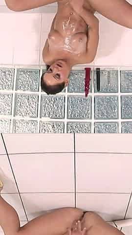 Beautiful brunette with great breasts and ass oils herself up and masturbates