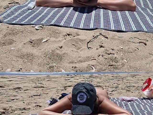 youthful woman gets banged on the beach by a stranger banging from behind