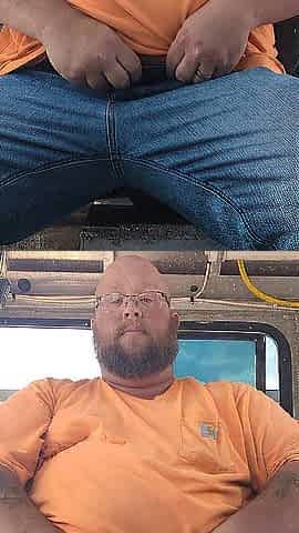 Bear Chub slapping balls at work
