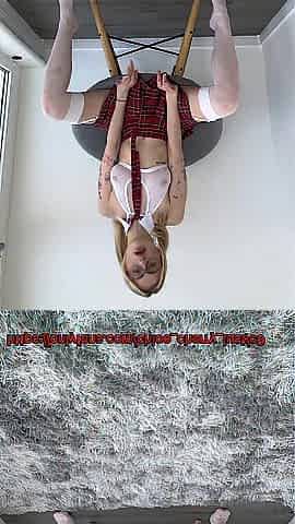 Blond in a student dress lifts her legs and shows her pink holes close-up to her ally