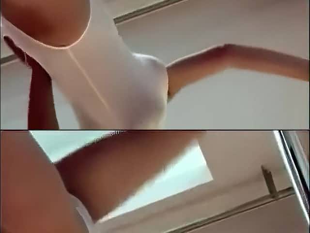 Flexible Asian ballerina stretches out