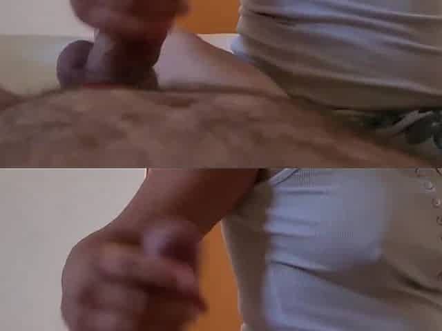 Hawt clothed cutie gives her coworker a tugjob whilst talking indecent to him. A lot of cum.