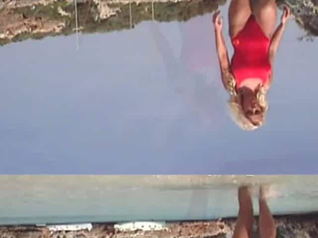 Lustful blonde Kelly Trump masturbates on rocks