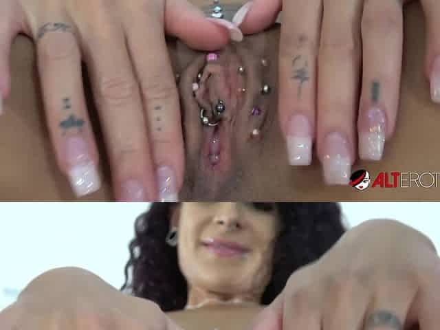 Tattooed Mara Martinez plays with her pierced pussy