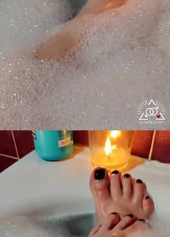 Sexy golden-haired massaging her soaked soapy feet in the baths