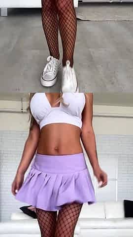 Monika Fox Posing In White Top, Purple Skirt And Showing