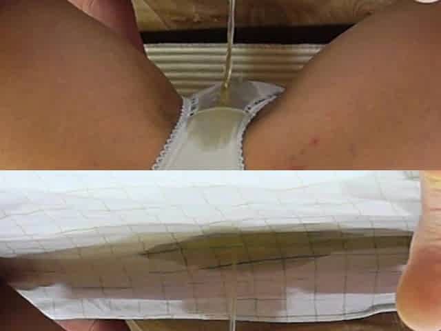A twat pissing in her white pants. A brunette hair pisses a lot at home.