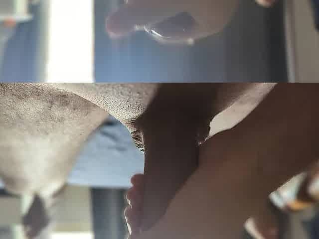 Masturbating with some sun rays throughout the window
