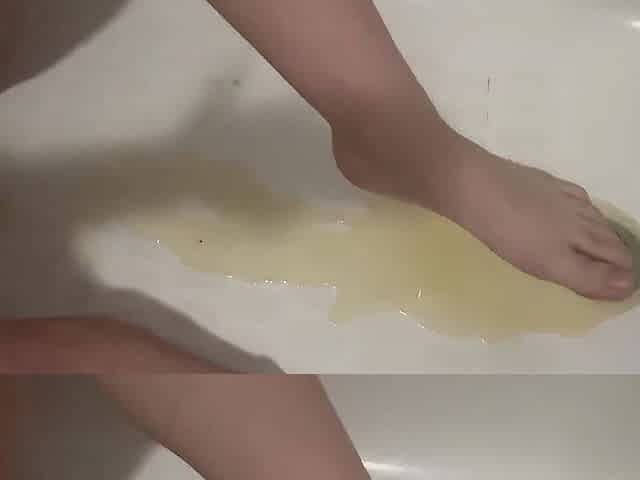 Ftm T-male bathing in his own void urine water