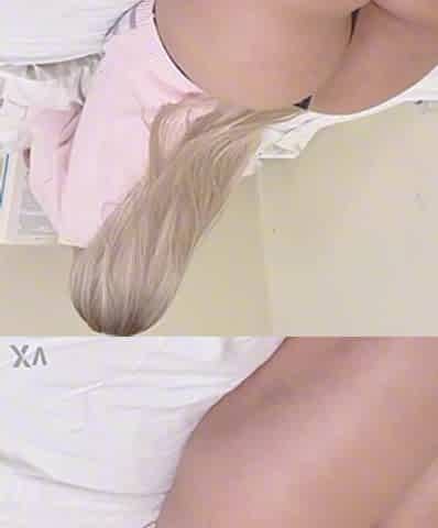 A nice-looking blond with a large ass is reading a book, showing off her big backside and wearing underware.
