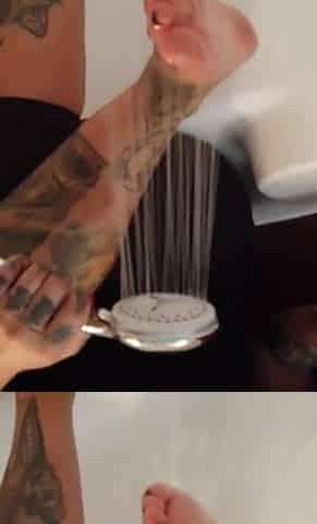 Tattooed blonde MILF washes her feet