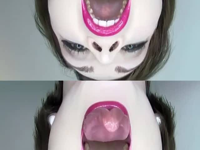 Her tongue is a actually weird color yet strangely arousing