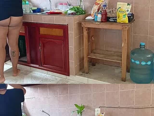 Neighbour Overweight lady in the kitchen of the apartment next door